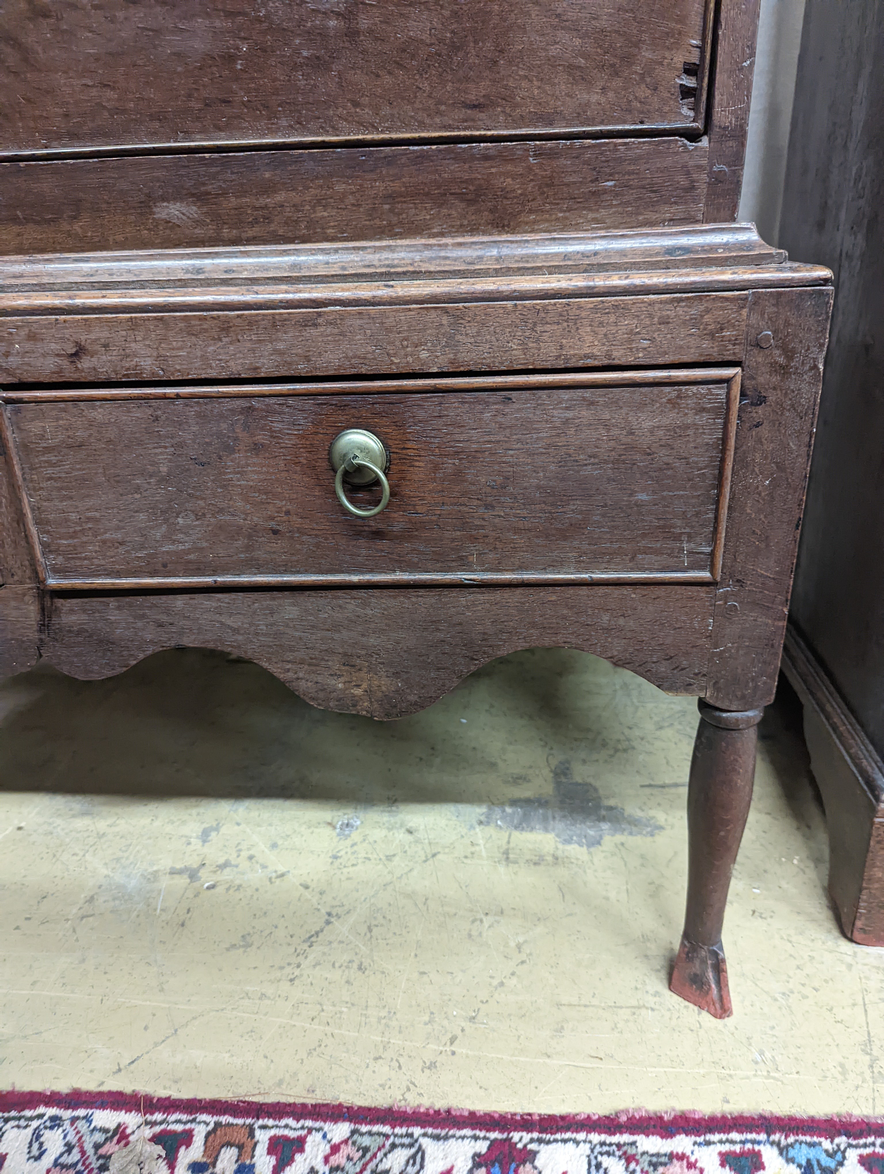 A mid 18th century oak chest on stand, width 89cm, depth 52cm, height 126cm